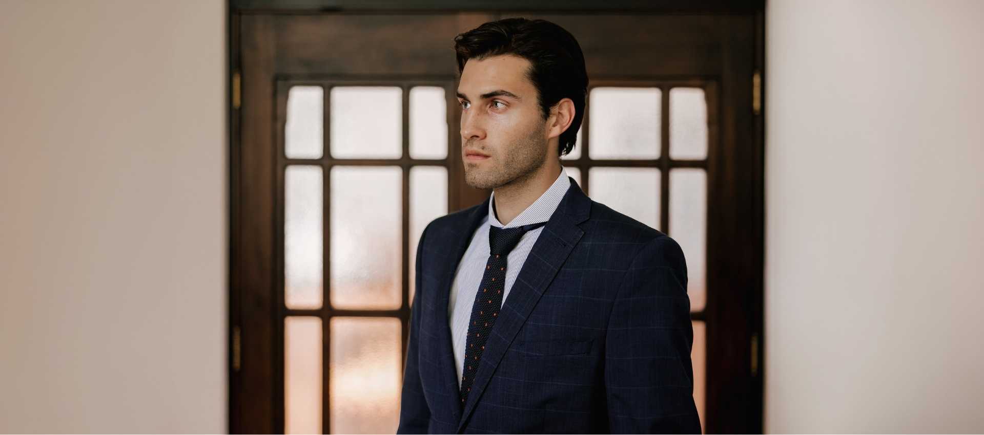 Collection of all Best Selling Dress Shirts for Men from Dandy & Son. Image of a man wearing a Extreme Cutaway Collar Shirt from Dandy & Son with a dark tie and suit.