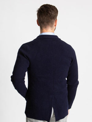 Navy double breasted knitted cashmere jacket back of model