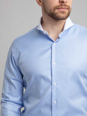 Close Up Of Model Wearing Dandy and Son Extreme Cutaway Collar Blue Contrast Shirt With French Cuff Close Up