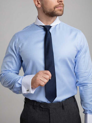 Close Up Of Model Wearing Dandy and Son Extreme Cutaway Collar Blue Contrast Shirt With French Cuff On Model With Tie