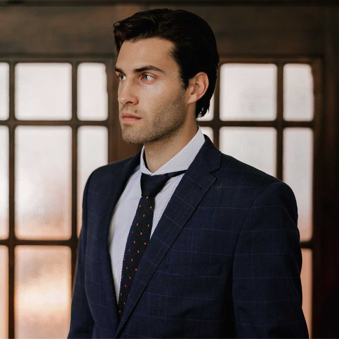 Close up of model wearing extreme cutaway collar dress shirt in classic blue stripe
