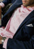 Close up of big pink stripe dress shirt on model 