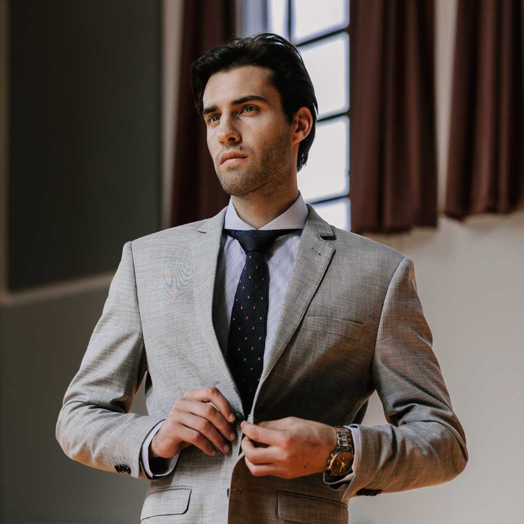 model wearing a great suit and dandy and son classic blue stripe extreme cutaway collar shirt with a tie
