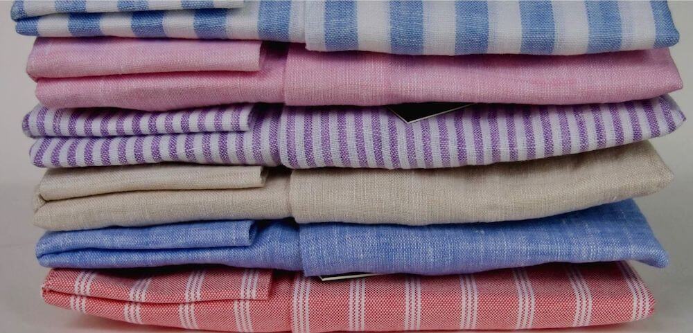 Mens linen cutaway shirts in different colours folded