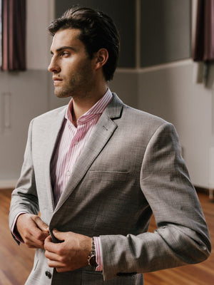 Dandy & Son Extreme Cutaway collar shirt in big pink stripes on a model with grey suit