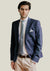 Model wearing extreme cutaway non iron dress shirt with navy suit and tie