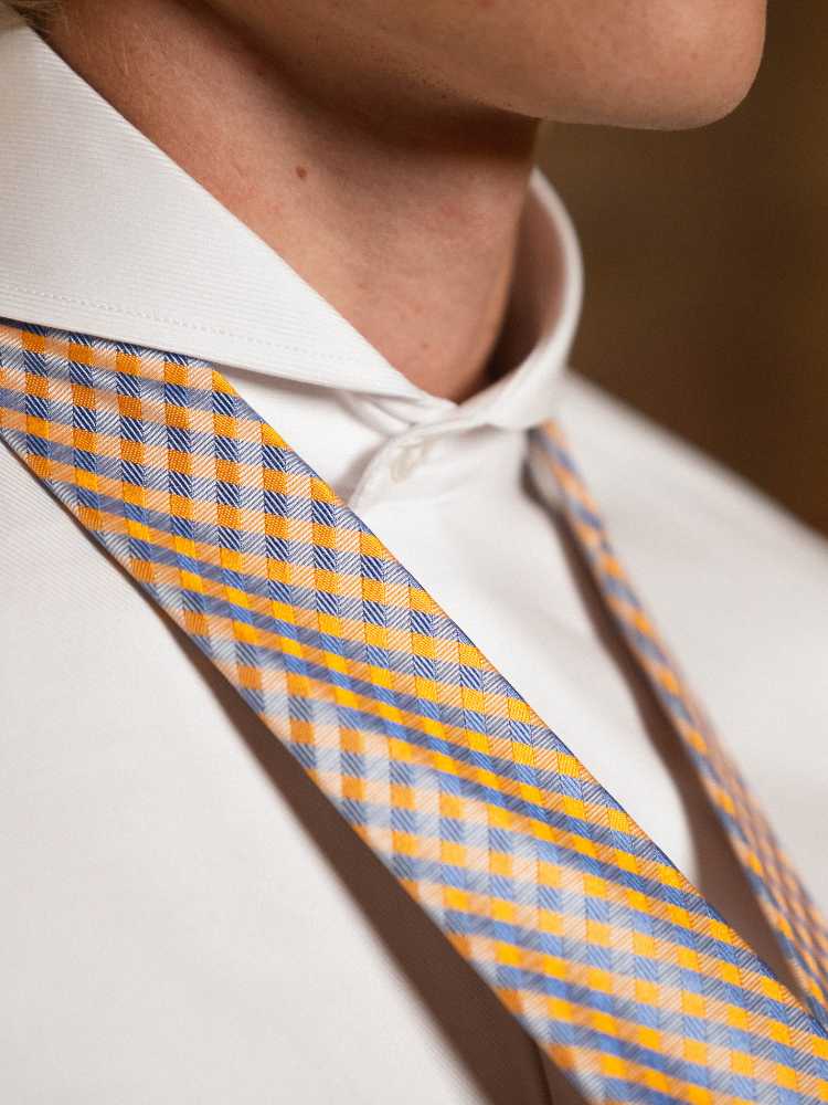 blue and orange tie and dress shirt