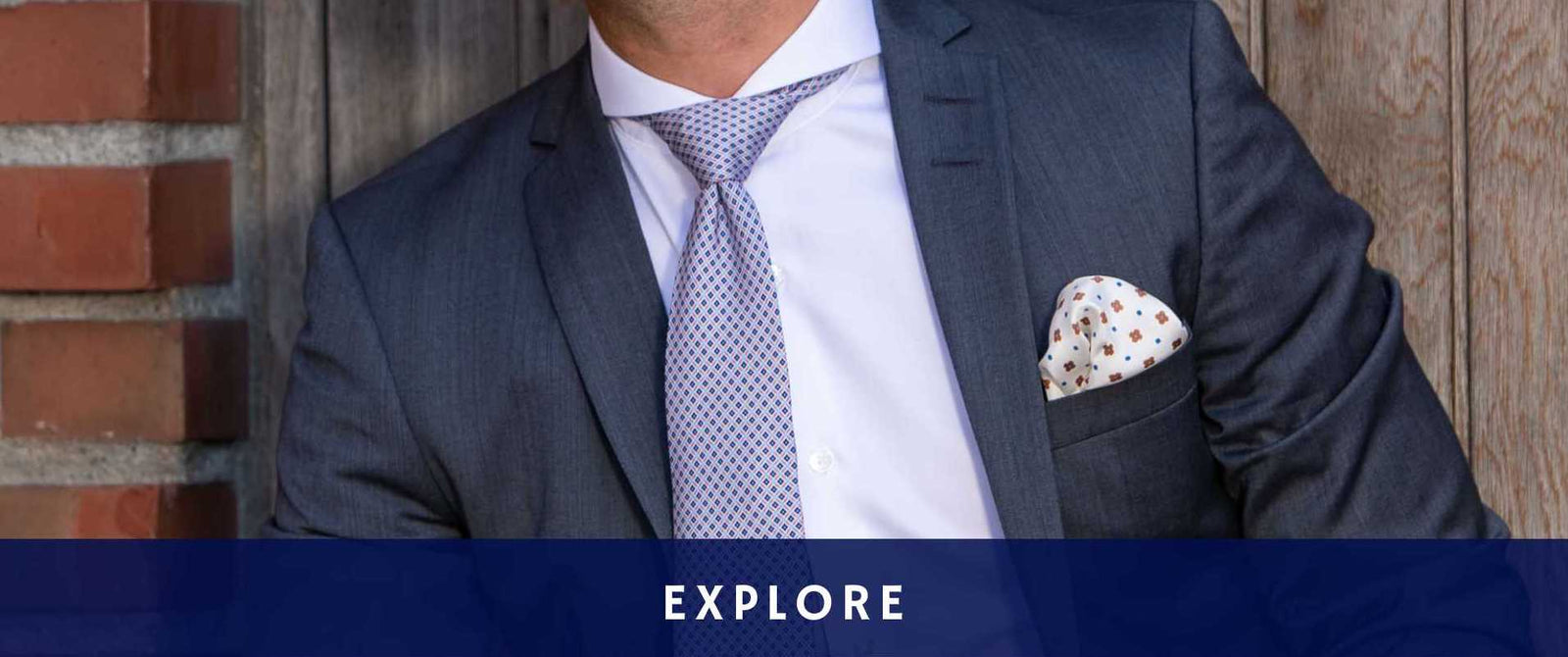 Model wearing extreme cutaway collar white dandy and son shirt with suit