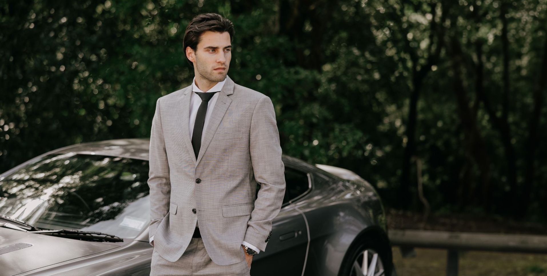 model wearing extreme cutaway collar white dress shirt with grey suit