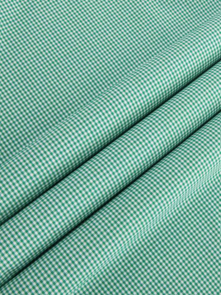 Extreme cutaway collar green grid shirt flat lay fabric
