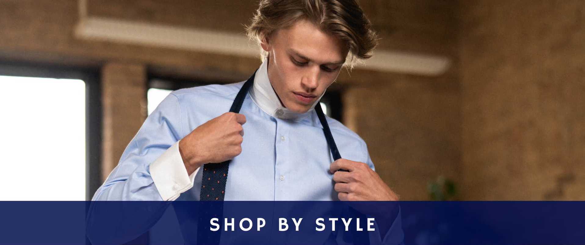 Model wearing contrast collar blue and white shirt close with with tie
