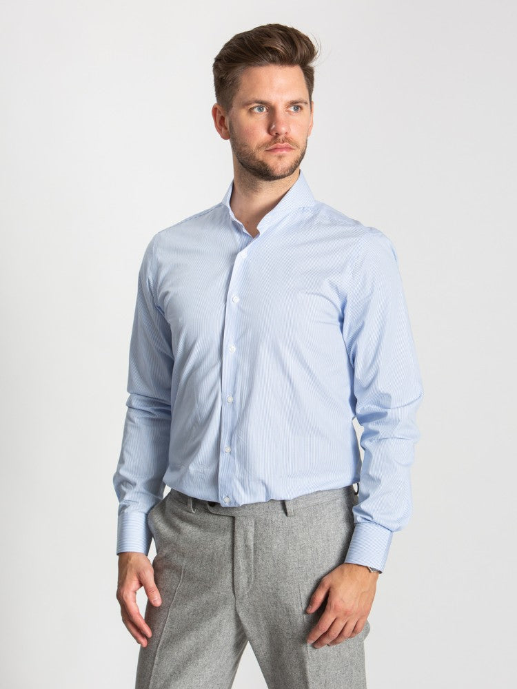 Extreme cutaway collar classic blue striped shirt flat lay image