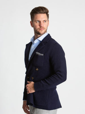 Navy double breasted knitted cashmere jacket on model 