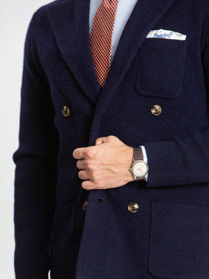 Navy double breasted knitted cashmere jacket on model close up