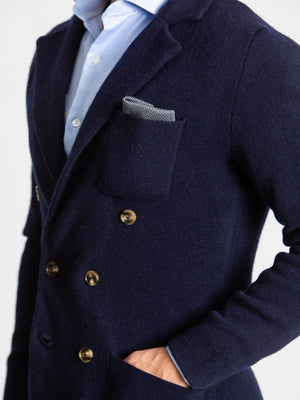 Navy double breasted knitted cashmere jacket on model close up