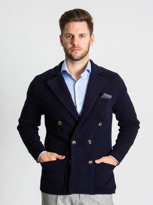 Navy double breasted knitted cashmere jacket on model 