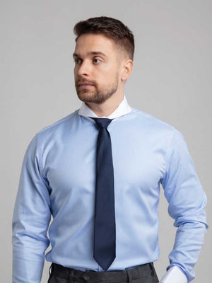 Close Up Of Model Wearing Dandy and Son Extreme Cutaway Collar Blue Contrast Shirt With French Cuff On Model With Tie